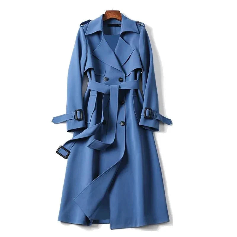 Elegant women's long double-breasted trench coat with a tie belt, ideal for office attire and classic style.