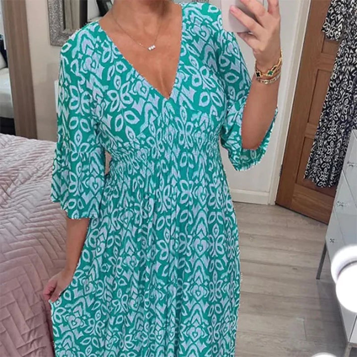 Chic women's long floral V-neck maxi dress, elegant and comfortable for any summer occasion.