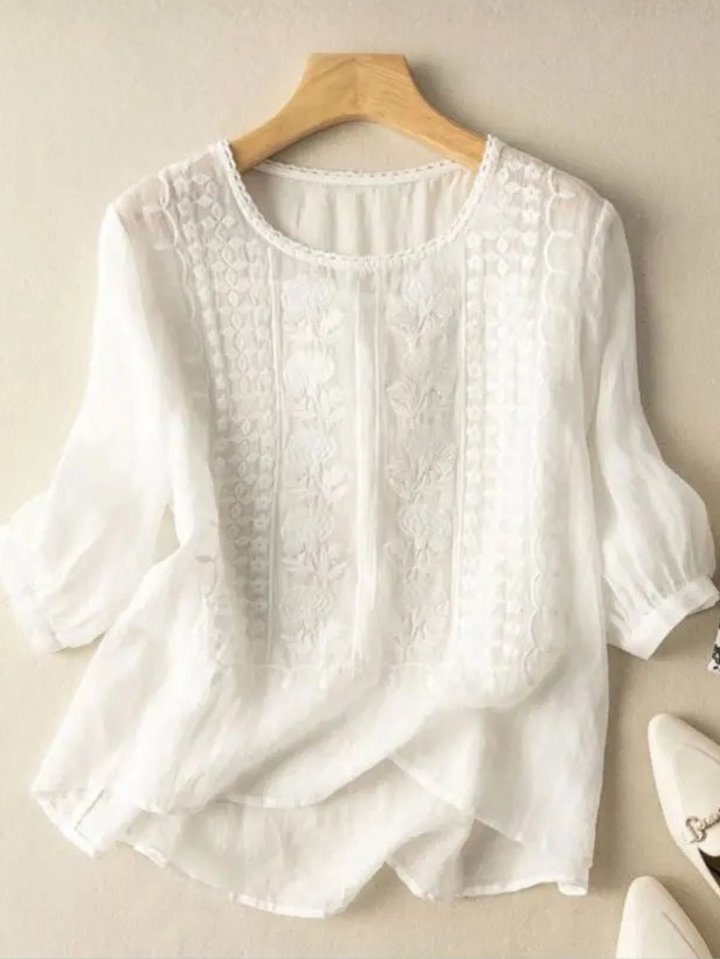 Elegant women's long sleeve blouse with intricate embroidery. Relaxed fit for versatile style, perfect for formal or casual.