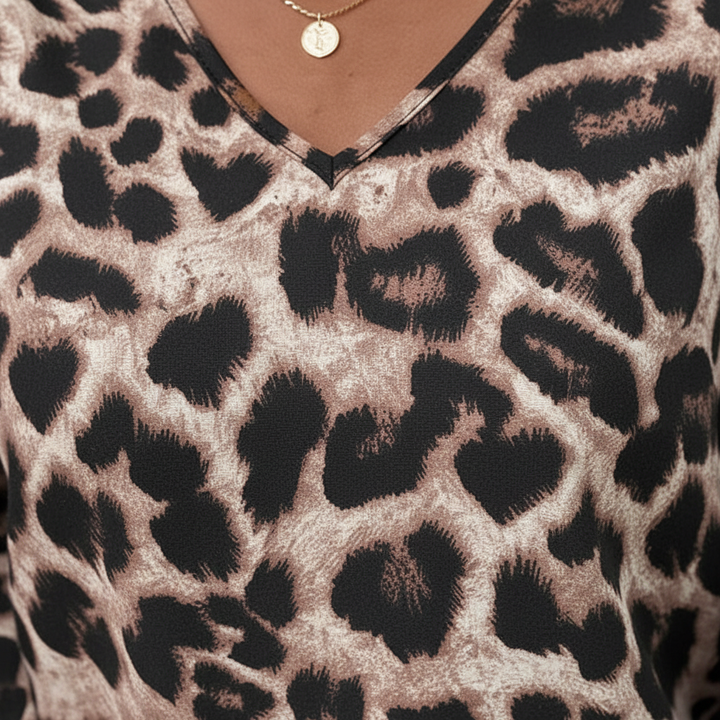 Women's elegant animal print long-sleeve blouse in a soft fabric, front view