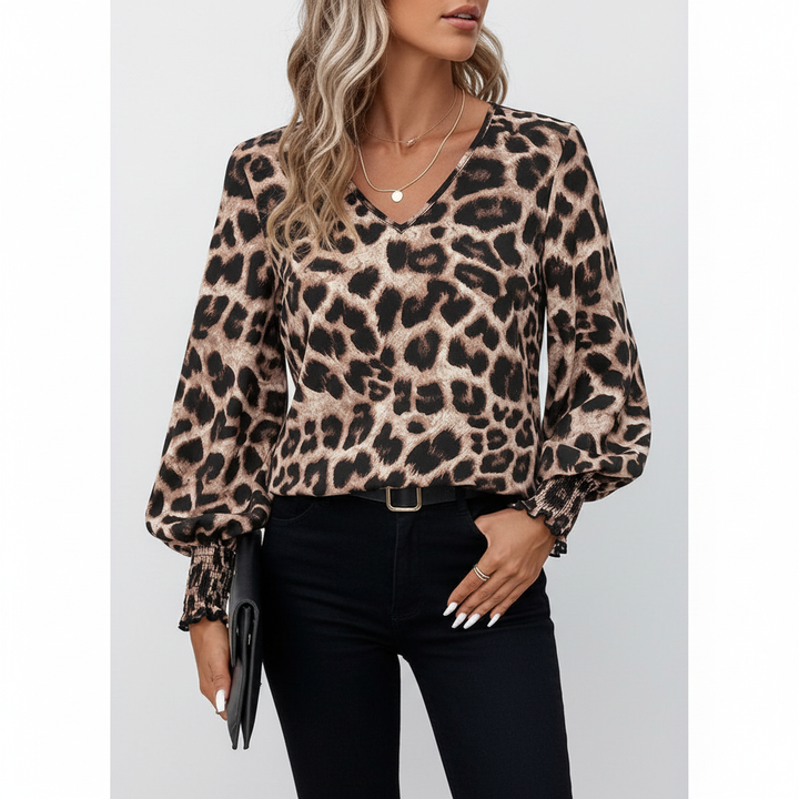 Close-up of a women's V-neck animal print blouse showcasing the chic leopard pattern