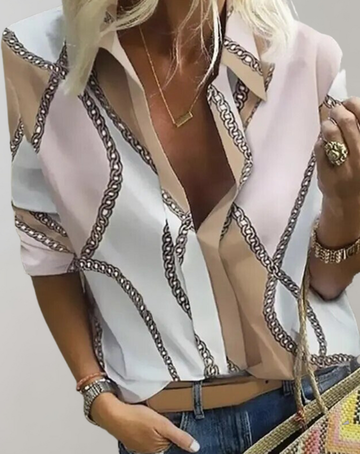 Stylish women's blouse with intricate chain print. Long sleeve top, ideal for polished office fashion & versatile wear.
