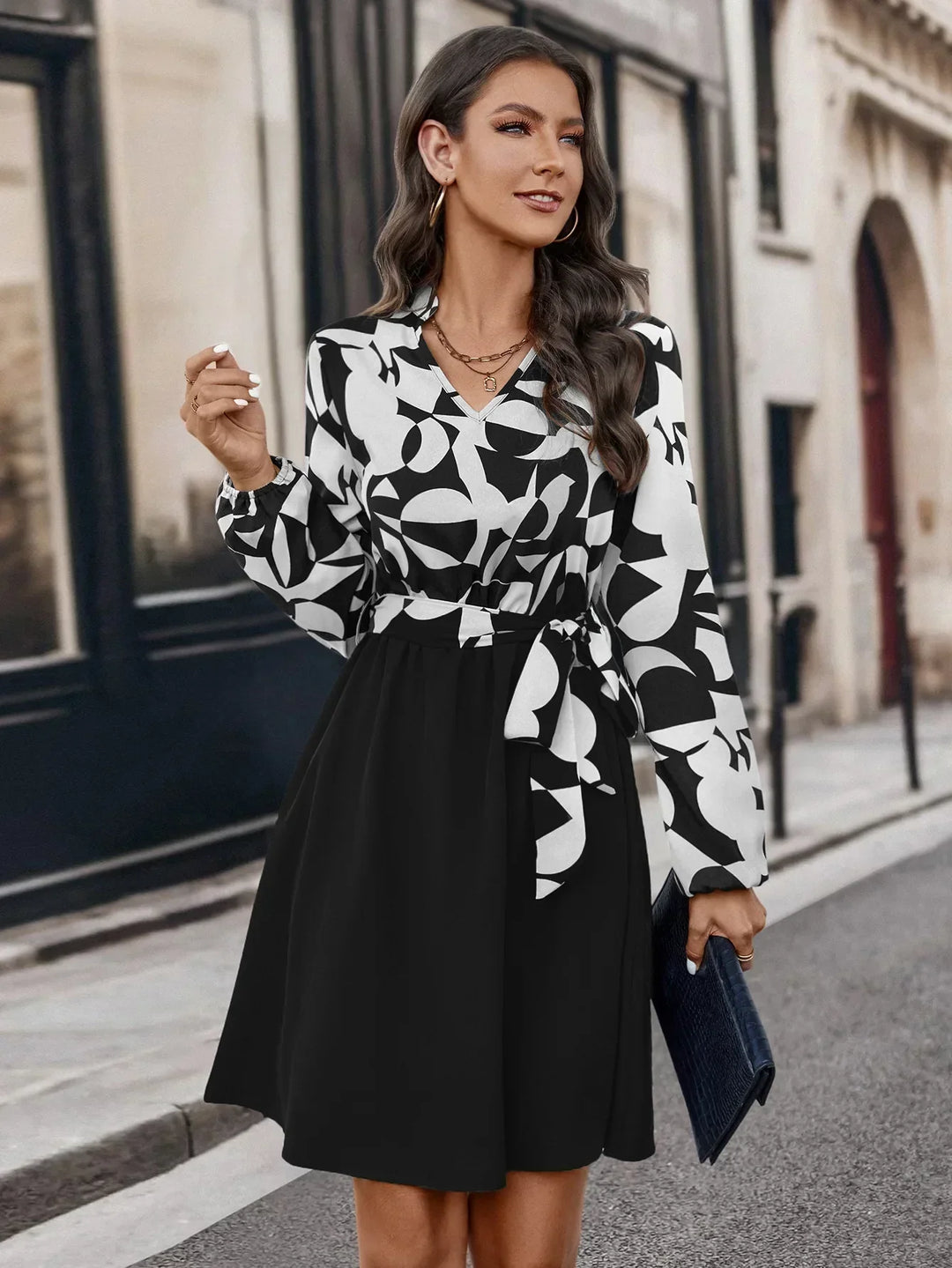 Elegant women's long sleeve V-neck knee-length dress. Versatile, casual-chic style for modern fall & spring fashion.