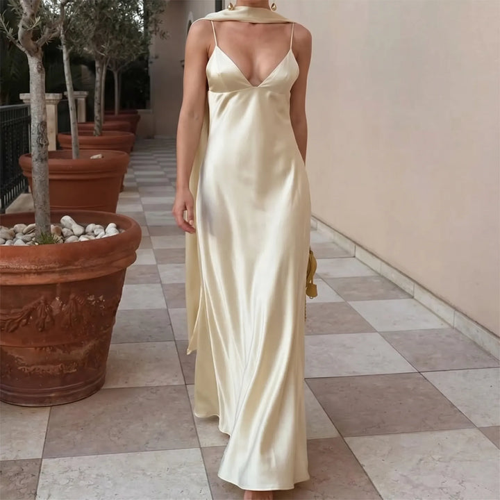 Elegant women's long slip dress for special evenings. Features an open back and V-neck. Perfect for formal parties.