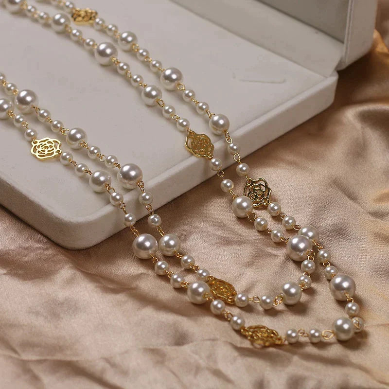 Elegant women's long white pearl necklace, perfect for a timeless look.