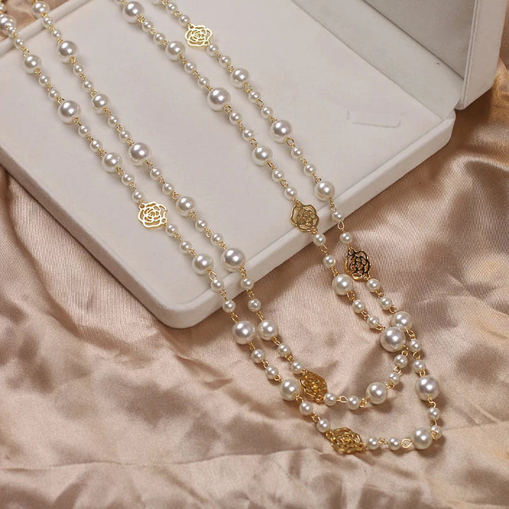 Adjustable long pearl necklace for women, a classic and elegant white pearl jewelry piece.