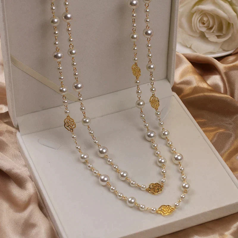 Classic women's long necklace with lustrous white pearls, adding an elegant touch to any outfit.