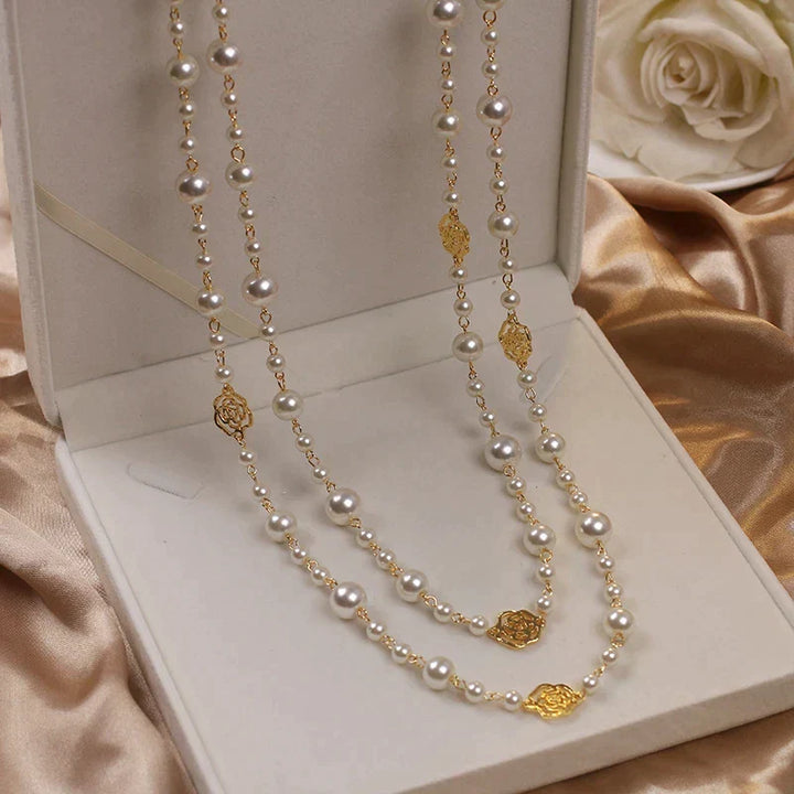 Classic women's long necklace with lustrous white pearls, adding an elegant touch to any outfit.