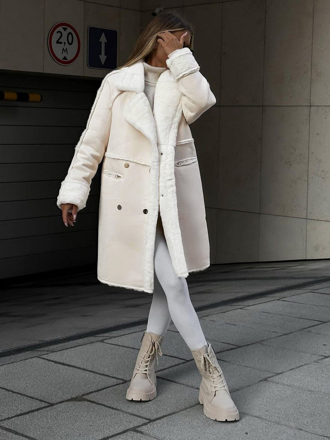 Elegant women's long winter coat in polar fleece. Chic & warm outerwear for stylish winter fashion.
