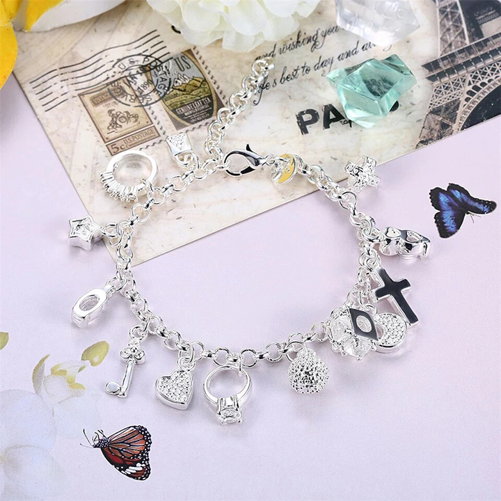 Adjustable women's elegant lucky charm bracelet. Silver-tone stainless steel, a stylish fashion accessory.