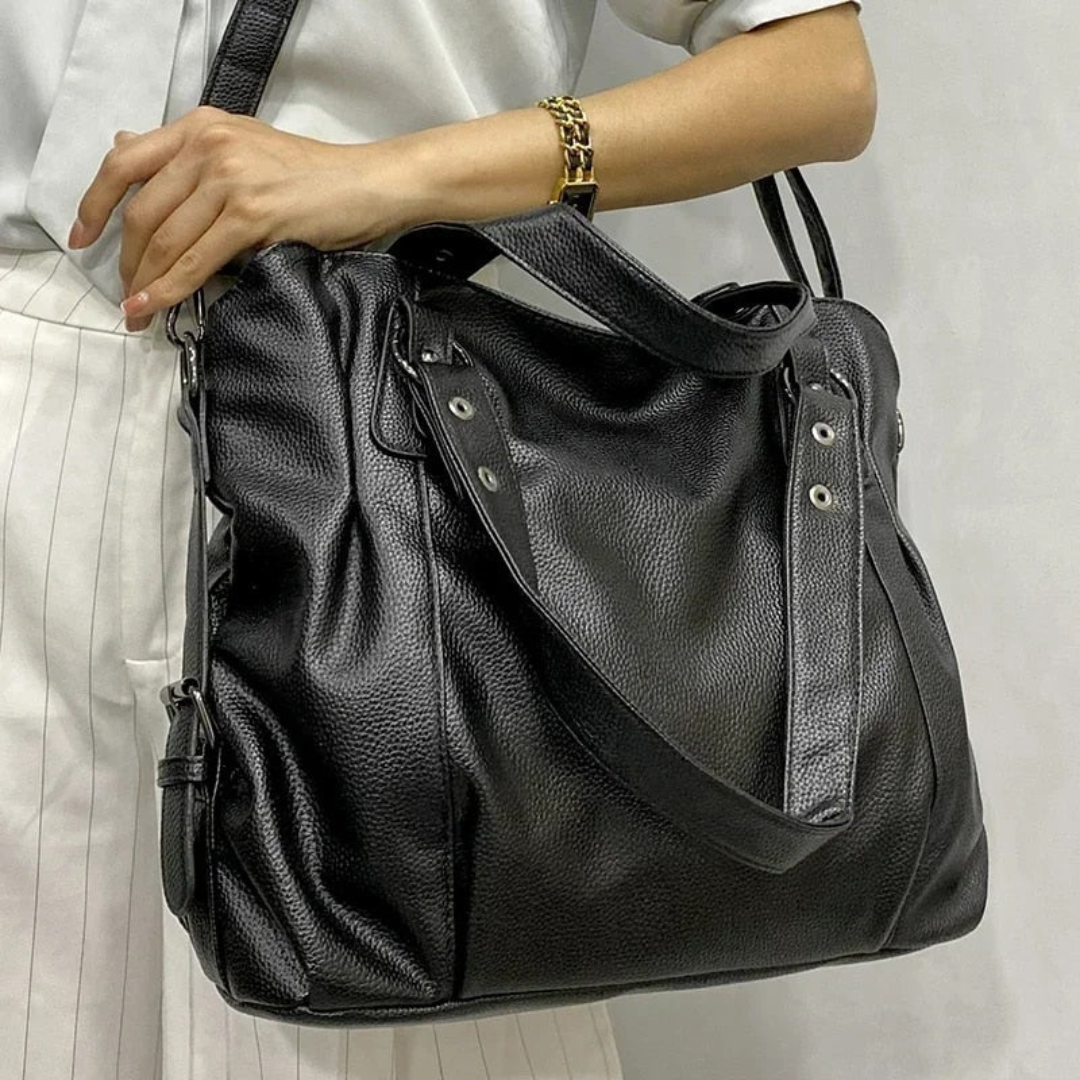 Chic women's leather shoulder tote bag. Spacious, versatile design for everyday luxury & elegance.
