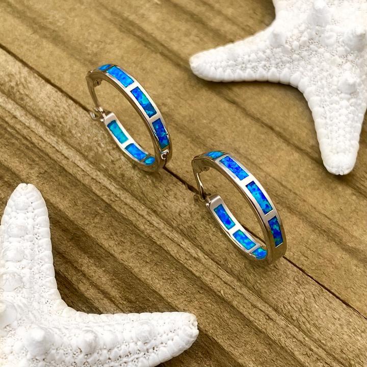 Beautiful women's silver ocean drop earrings with iridescent opals. Fine, elegant, nature-inspired jewelry.