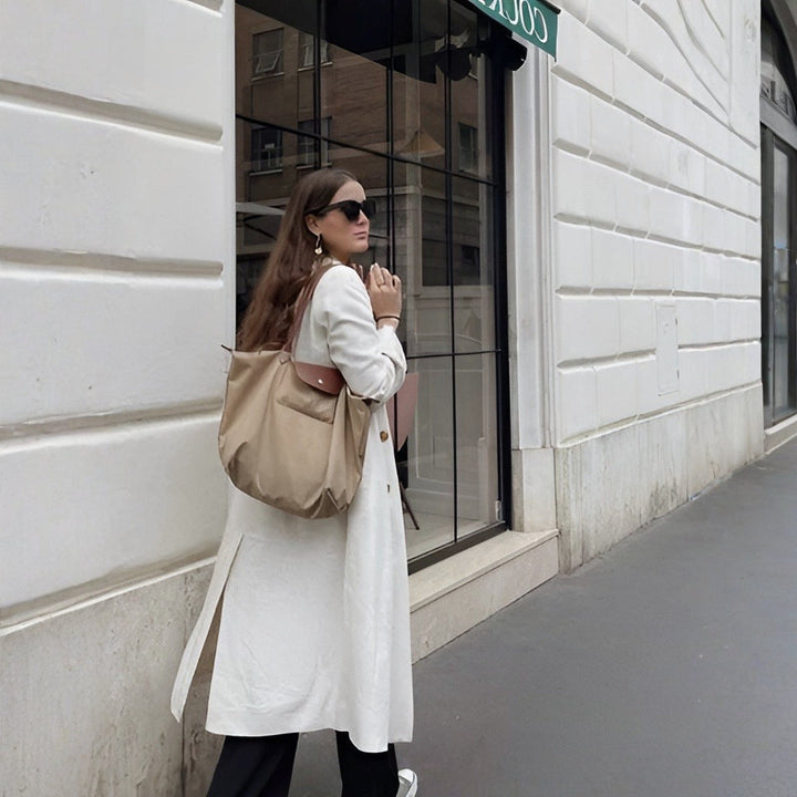 Sophisticated women's luxury top handle bag, premium synthetic leather, an elegant and versatile handbag.