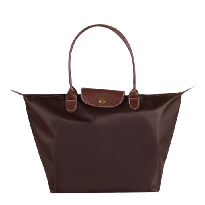 Chic women's top handle bag, an elegant everyday carry accessory made from durable synthetic leather.