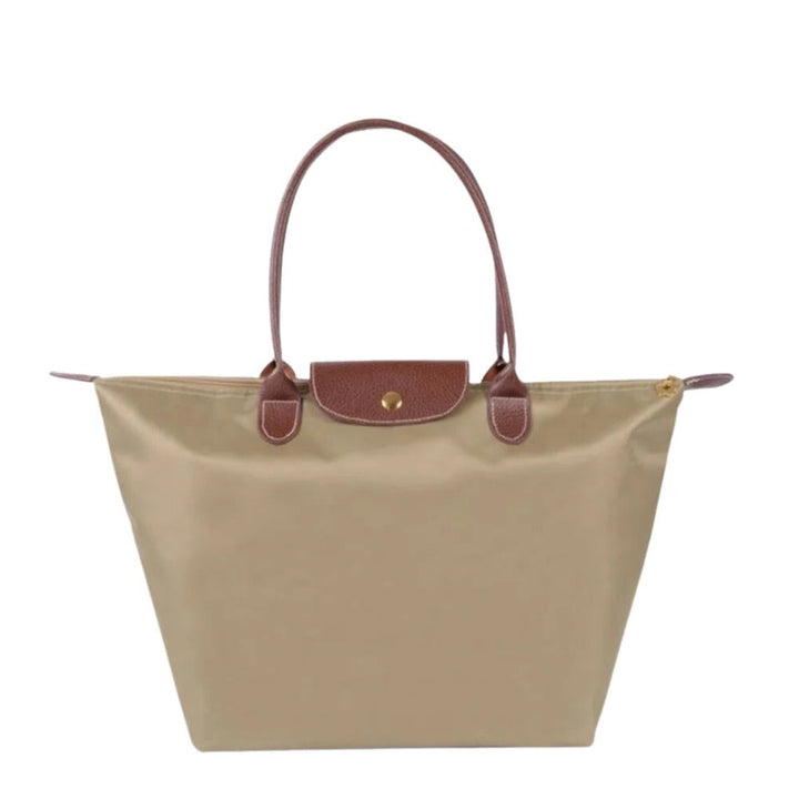 Fashionable women's luxury top handle bag, elegant synthetic leather, versatile for day or evening wear.