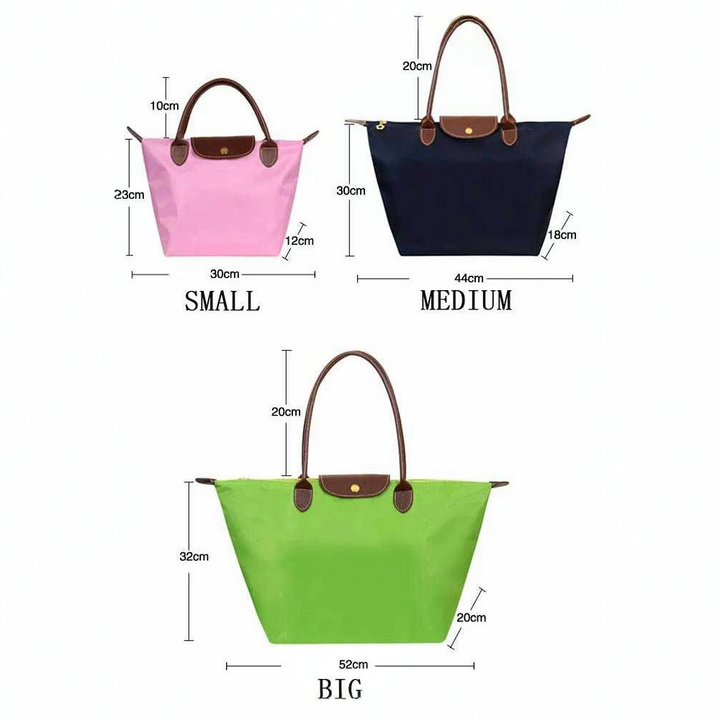 Designer quality women's elegant top handle bag, luxurious synthetic leather, a versatile fashion accessory.