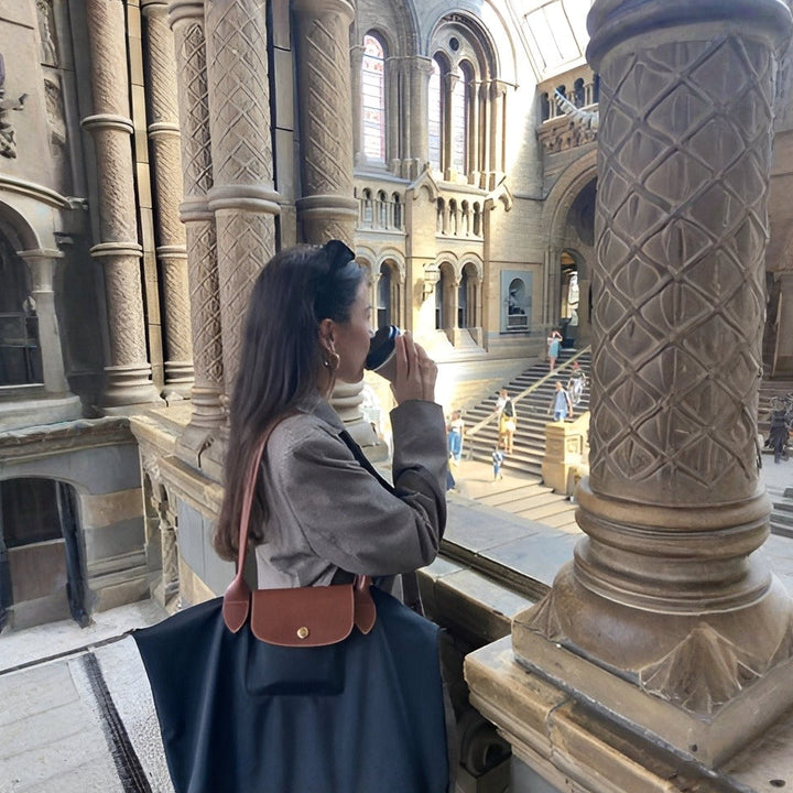 Elegant women's top handle bag, luxurious synthetic leather, practical everyday carry with designer style.