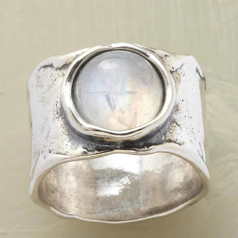 Elegant women's Lyra silver ring featuring a shimmering moonstone, embodying ethereal charm and celestial beauty.