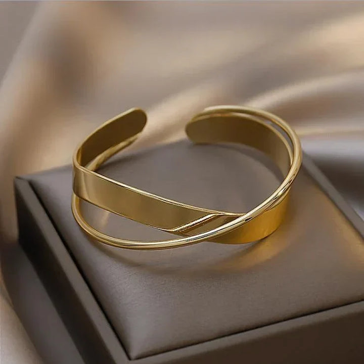 Timeless matte gold infinity bracelet for women. An elegant and delicate gift, perfect as a chic wrist accessory.