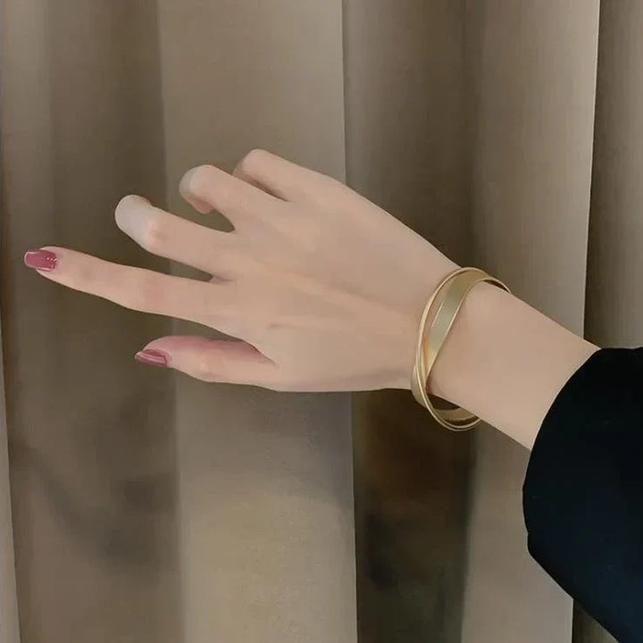 Matte gold infinity symbol bracelet for women. Elegant, delicate gold jewelry with a timeless appeal, ideal gift.