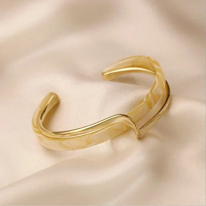 Beautiful matte gold women's bracelet with a delicate infinity symbol. Elegant gold jewelry, a timeless gift accessory.