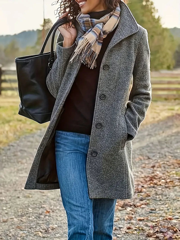 Versatile women's button-front trenchcoat, featuring a stylish lapel. Chic mid-length outerwear for fall.