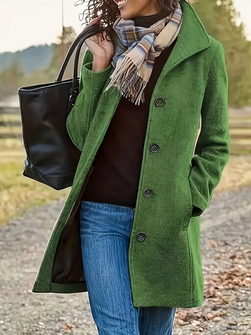 Tailored women's fall/winter coat: Elegant lapel, button-front, mid-length trenchcoat style outerwear.