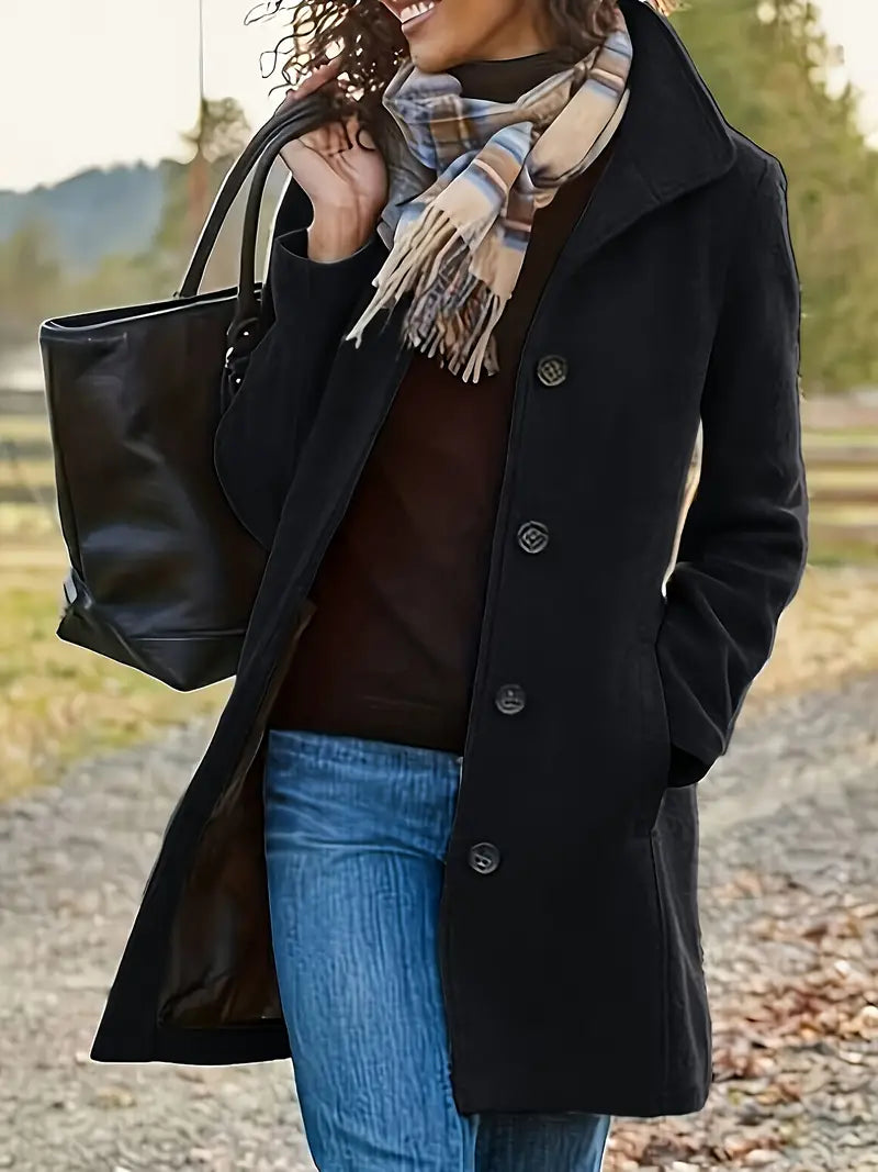 Timeless women's mid-length trenchcoat. Classic lapel & button-front design. Elegant fall/winter outerwear.