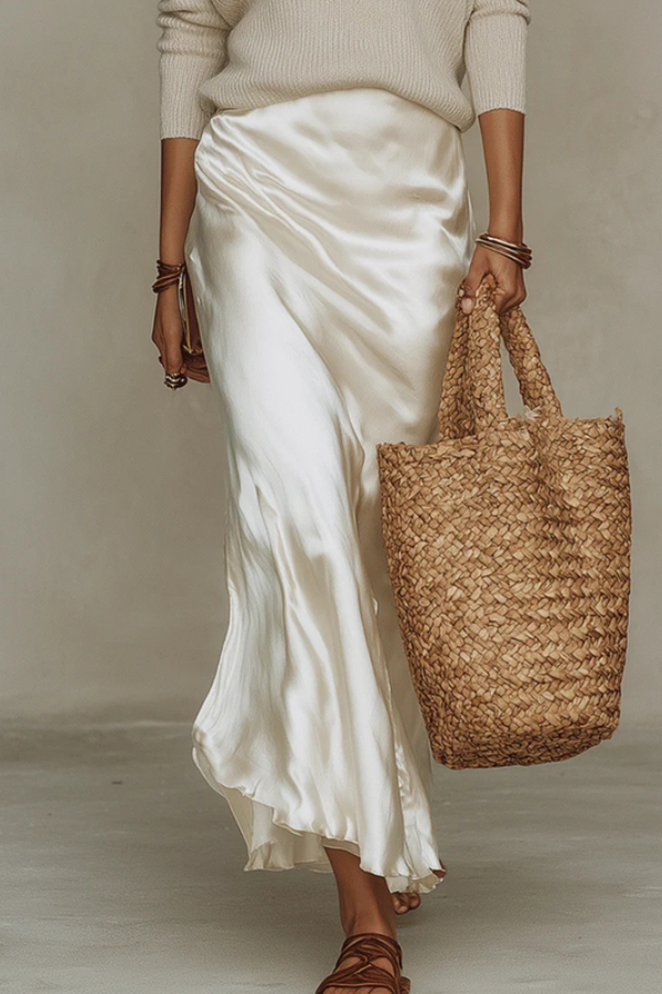 Women's elegant midi dress and cozy sweater two-piece set for a sophisticated, casual chic layered outfit.