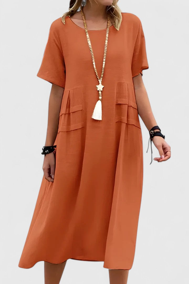 Versatile beige midi dress for women, elegant and flattering for daytime or evening events. Comfortable fit.
