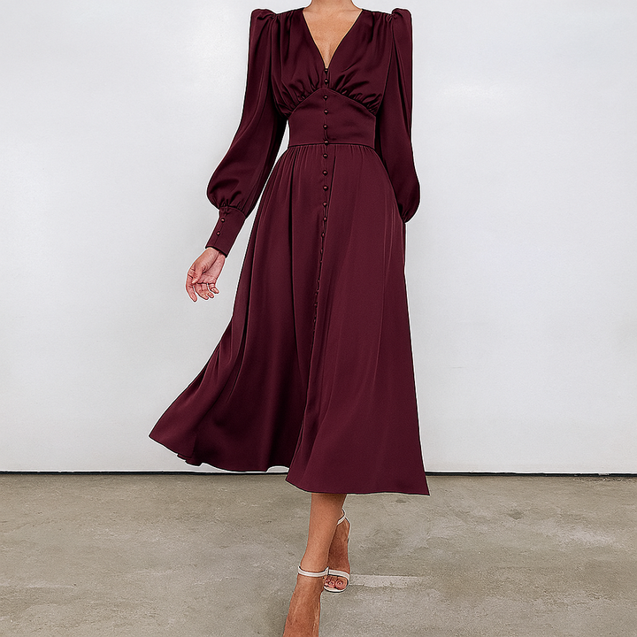 Sophisticated women's midi dress for evening wear. Features elegant puffed sleeves & flattering v-neck.