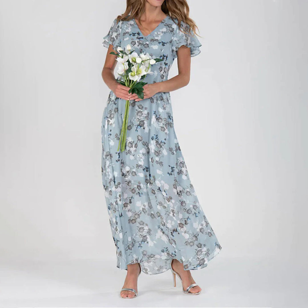 Versatile women's floral midi dress, ideal for casual summer days or elegant spring events. Fashionable V-neck.