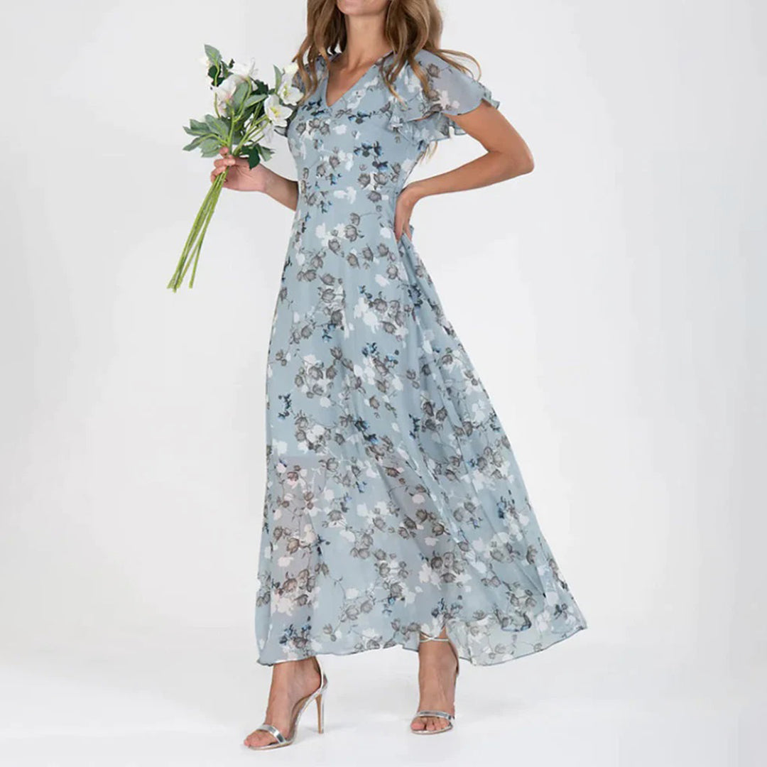 Beautiful women's floral midi dress, an elegant choice for spring and summer. Features a flattering V-neck.