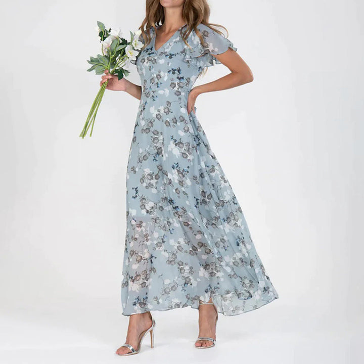 Beautiful women's floral midi dress, an elegant choice for spring and summer. Features a flattering V-neck.