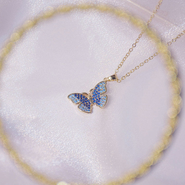 Woman wearing an elegant mini pearl charm necklace. A short pearl necklace complementing her classic style.