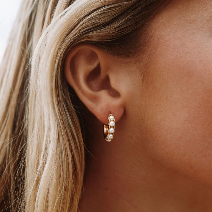Elegant women's mini pearl earrings, perfect for everyday wear. Gold plated, water-resistant & hypoallergenic.