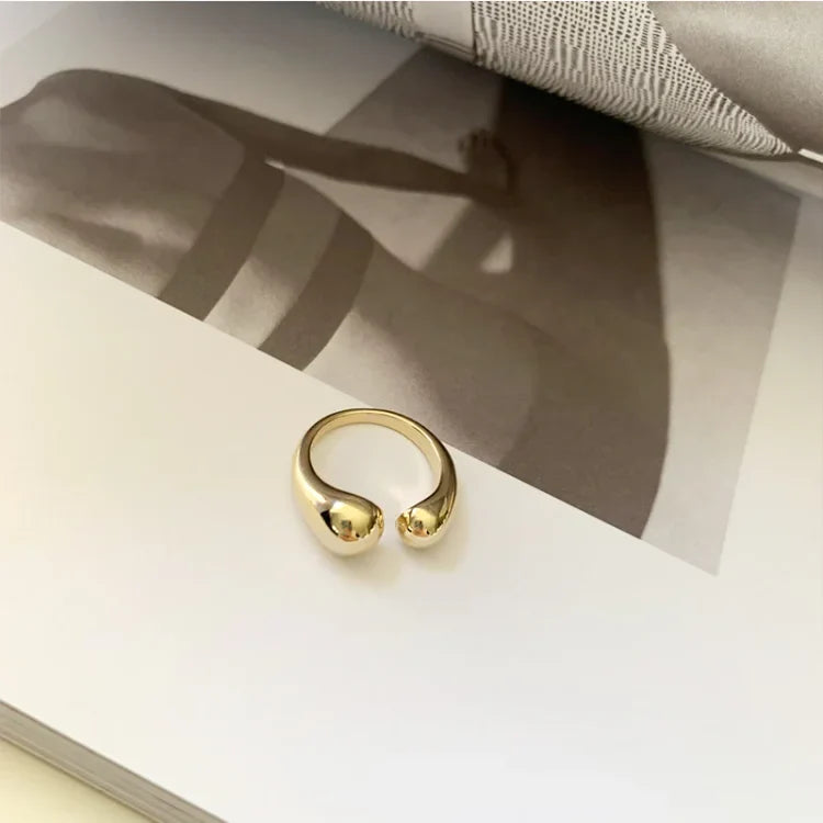 Women's minimalist adjustable ring, available in gold plated or silver. Elegant, hypoallergenic & stackable jewelry.