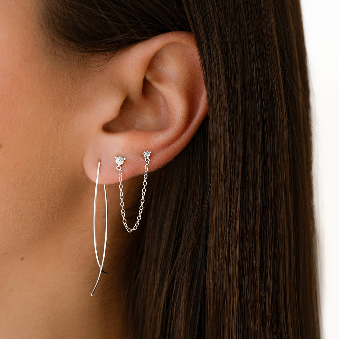 Stylish gold minimalist hoop earrings for women. Versatile everyday fashion jewelry, modern design.