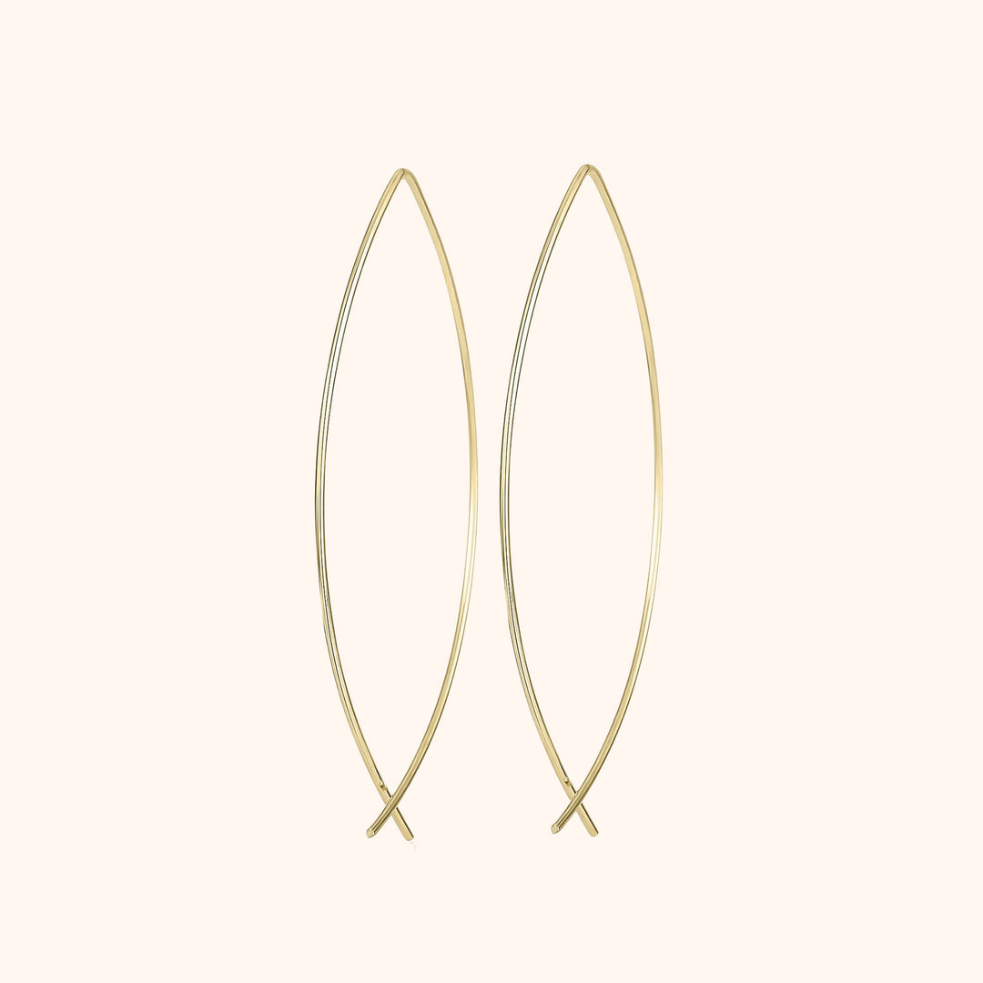 Women's silver minimalist hoop earrings. Elegant and modern fashion jewelry, perfect for everyday style.