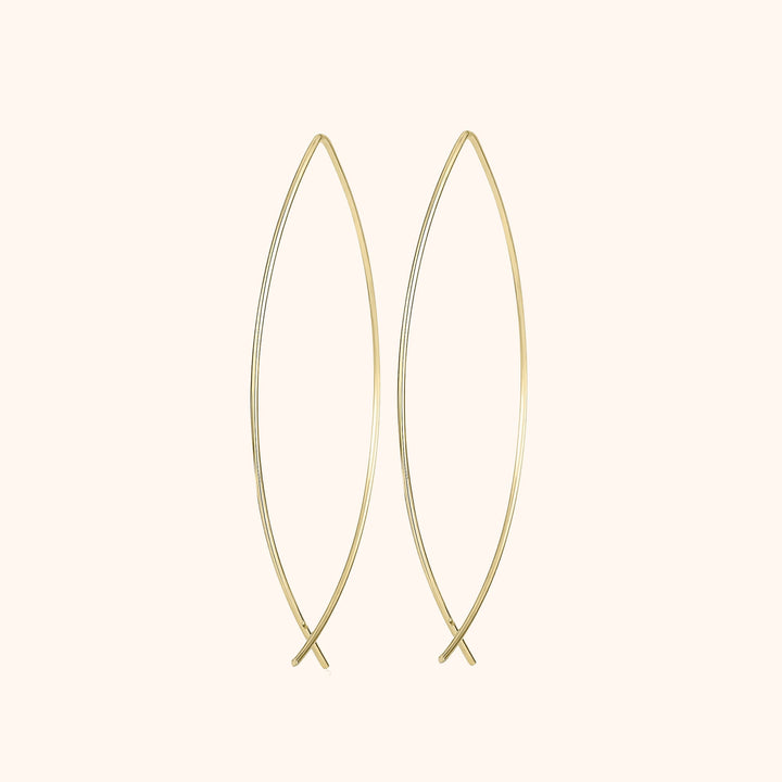 Women's silver minimalist hoop earrings. Elegant and modern fashion jewelry, perfect for everyday style.