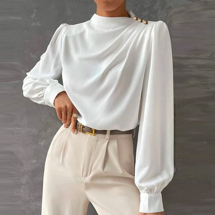 Dressy women's ruched mock neck blouse, featuring chic gold button cuffs. Ideal for professional or smart casual.