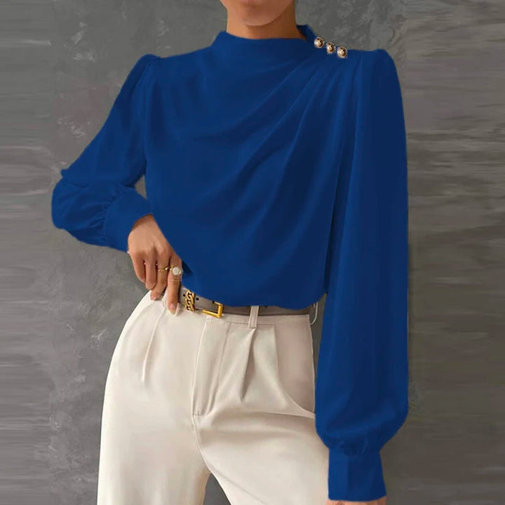 Fashionable women's blouse with a mock neck, long sleeves & flattering ruched detail. Great for office elegance.
