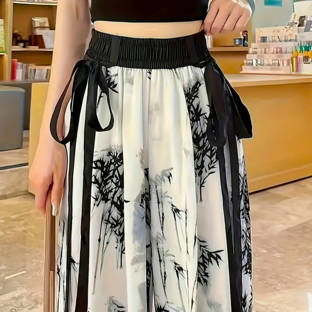 Naomi women's trousers, elegant white print, ideal for office wear or casual fashion. Comfortable polyvinyl fabric.