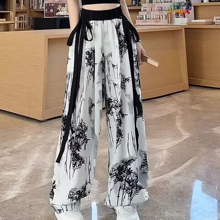 Versatile Women's Naomi trousers: elegant, comfortable polyvinyl with a stylish white print. Perfect for fashion-forward looks.