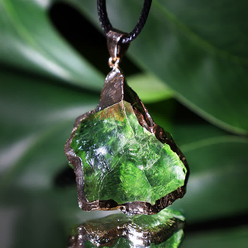 Natural Moldavite gemstone necklace for women, a unique spiritual pendant with cosmic green hues.