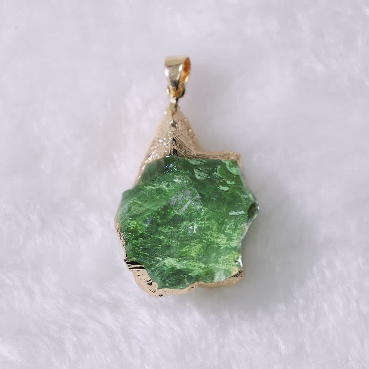 Raw natural Moldavite gemstone pendant on a women's necklace, a unique cosmic spiritual jewelry piece.