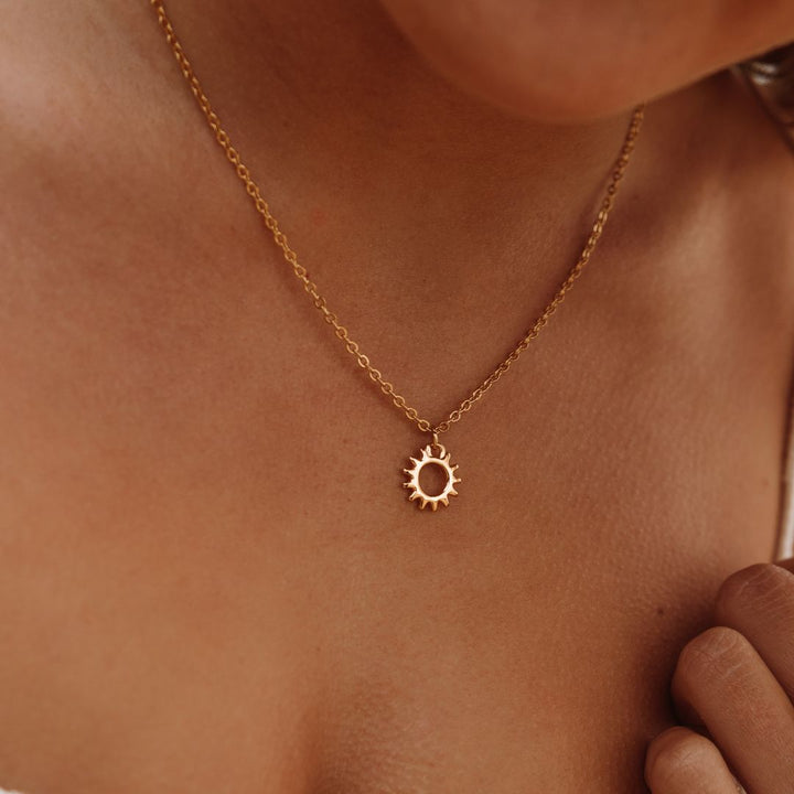 Elegant women's necklace with radiant sun design pendant, perfect for everyday celestial style. Solara jewelry.