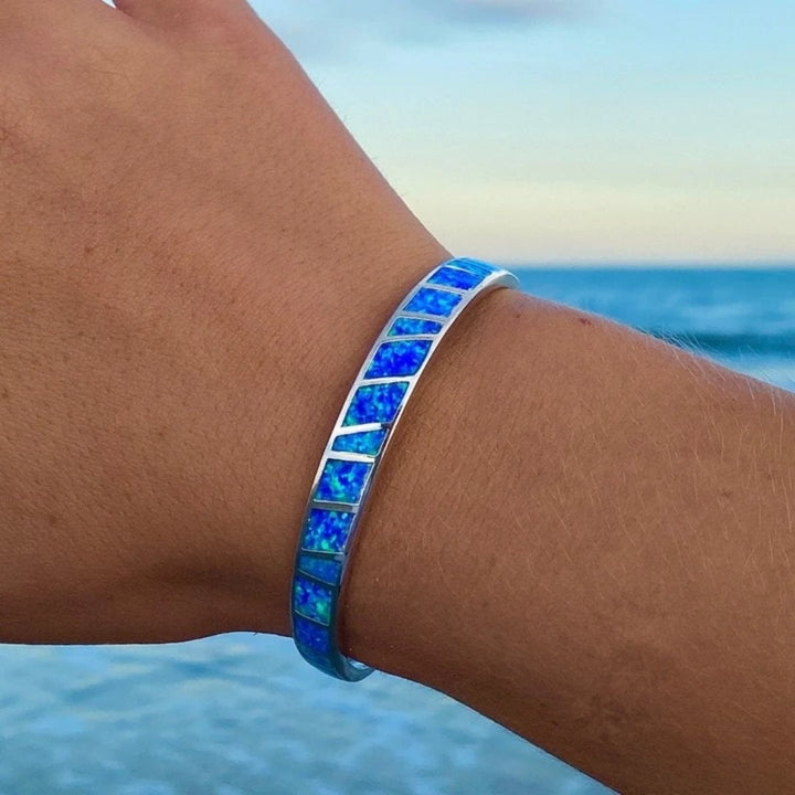 Elegant women's ocean-inspired blue opal and sterling silver bracelet, a timeless jewelry gift for her.