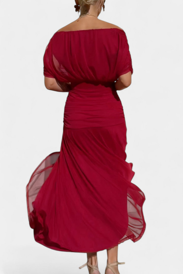 Sophisticated women's elegant maxi dress, featuring an off-shoulder neckline and flattering draped design for evening.