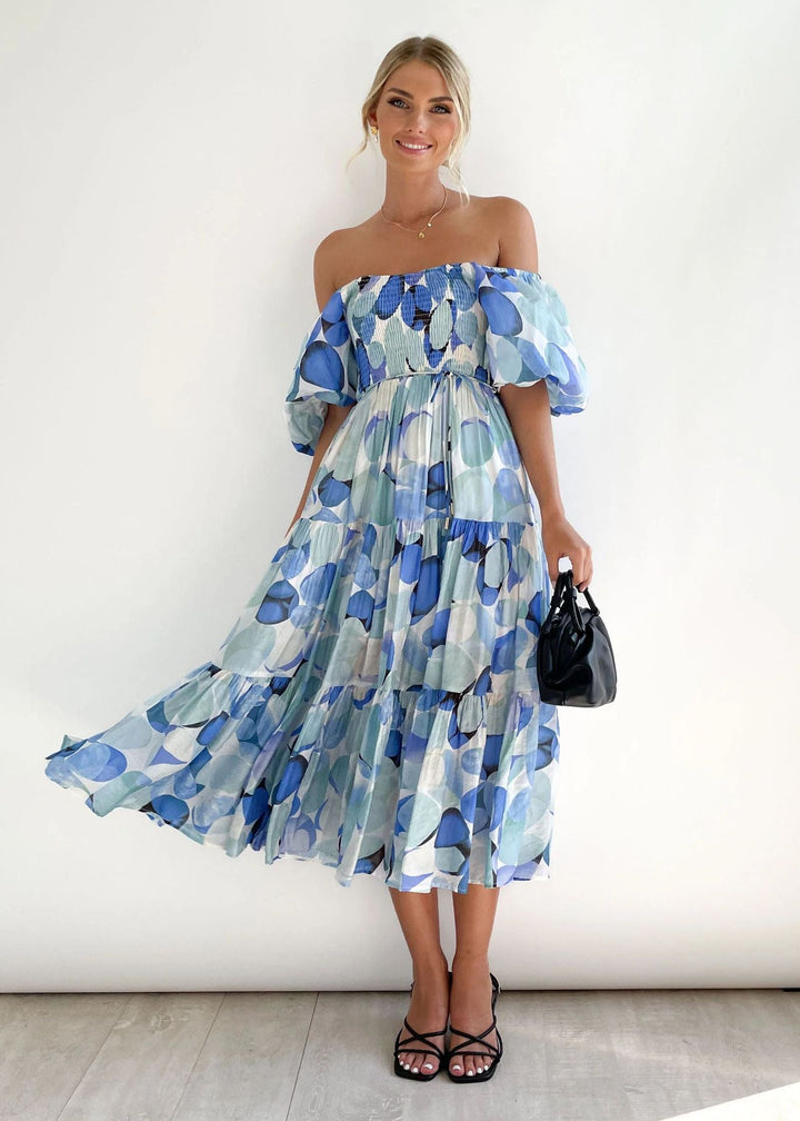 Chic women's off-shoulder ruffle midi dress, ideal elegant party or vacation wear. Flowing summer fashion.